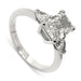 14kt white gold three-stone engagement ring with radiant cut lab diamond and pear side stones
