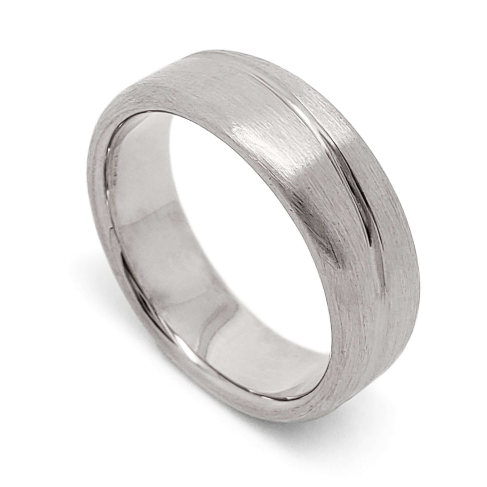 14kt white gold wedding ring with brushed finish and asymmetrical carved line