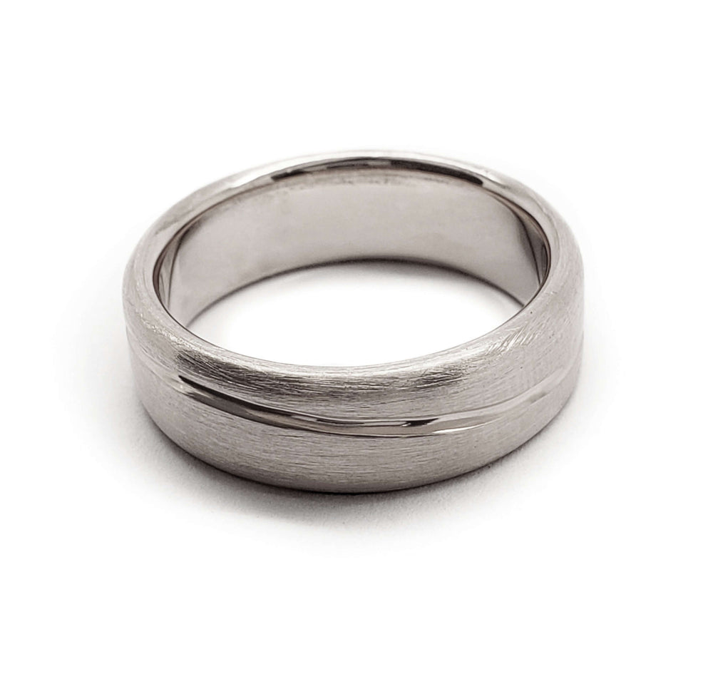 14kt white gold wedding ring with brushed texture and carved wave line, top view