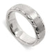 14kt white gold wedding ring with brushed top and engraved edges, angled view