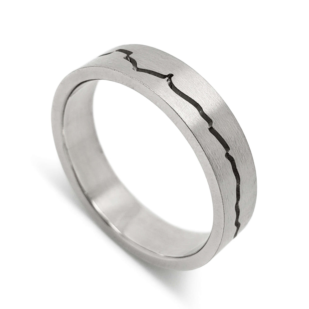 14kt white gold wedding ring with engraved mountain range design and brushed finish