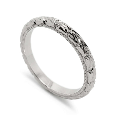 14kt white gold wedding ring with wheat engraving and millgrain edge, angled view