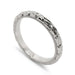 14kt white gold wedding ring with wheat engraving and millgrain edge, angled view