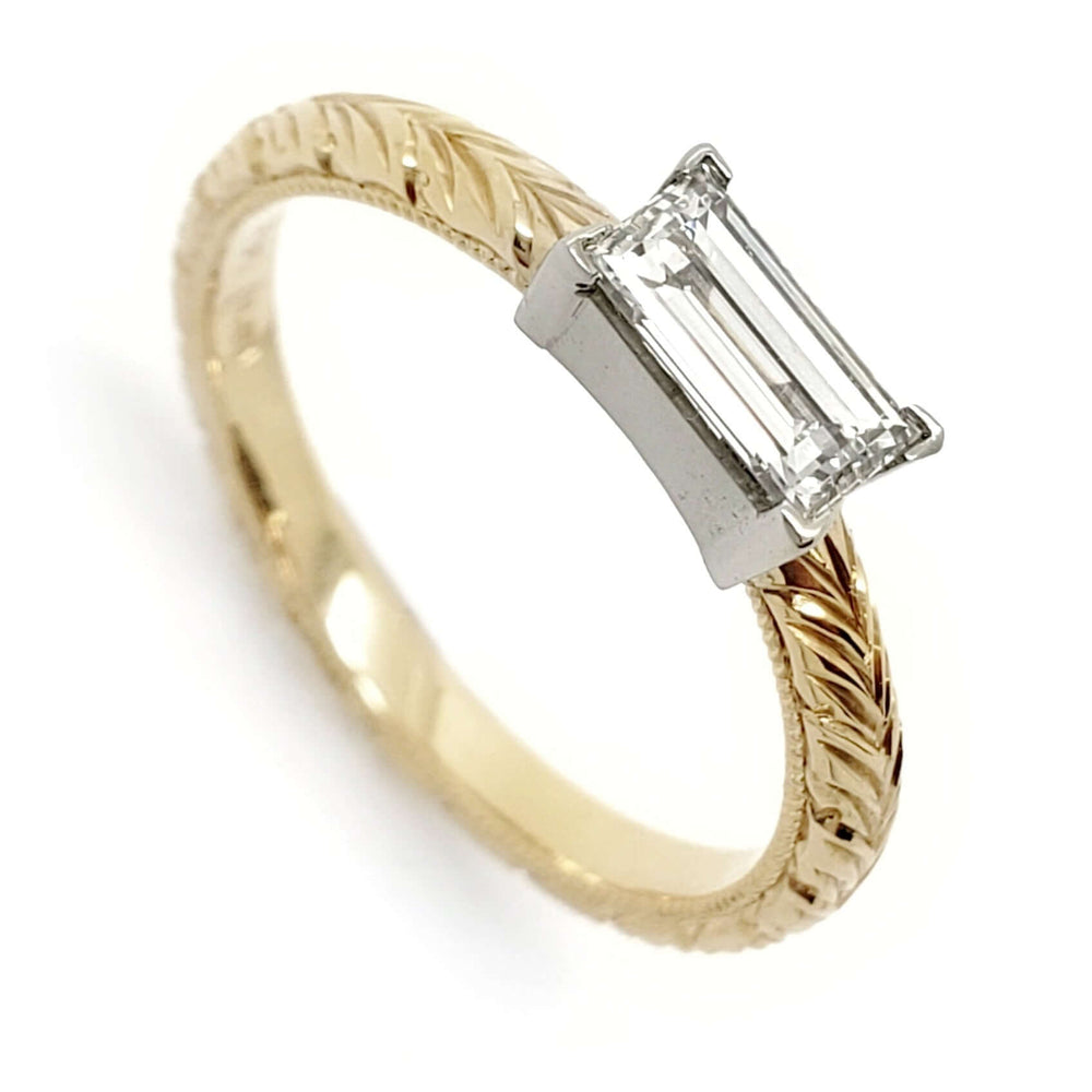 Handcrafted 14kt yellow and white gold engagement ring with baguette Canadian diamond and engraved band