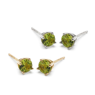 Pair of 14kt yellow and white gold peridot stud earrings in a 4-claw setting