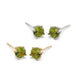Pair of 14kt yellow and white gold peridot stud earrings in a 4-claw setting