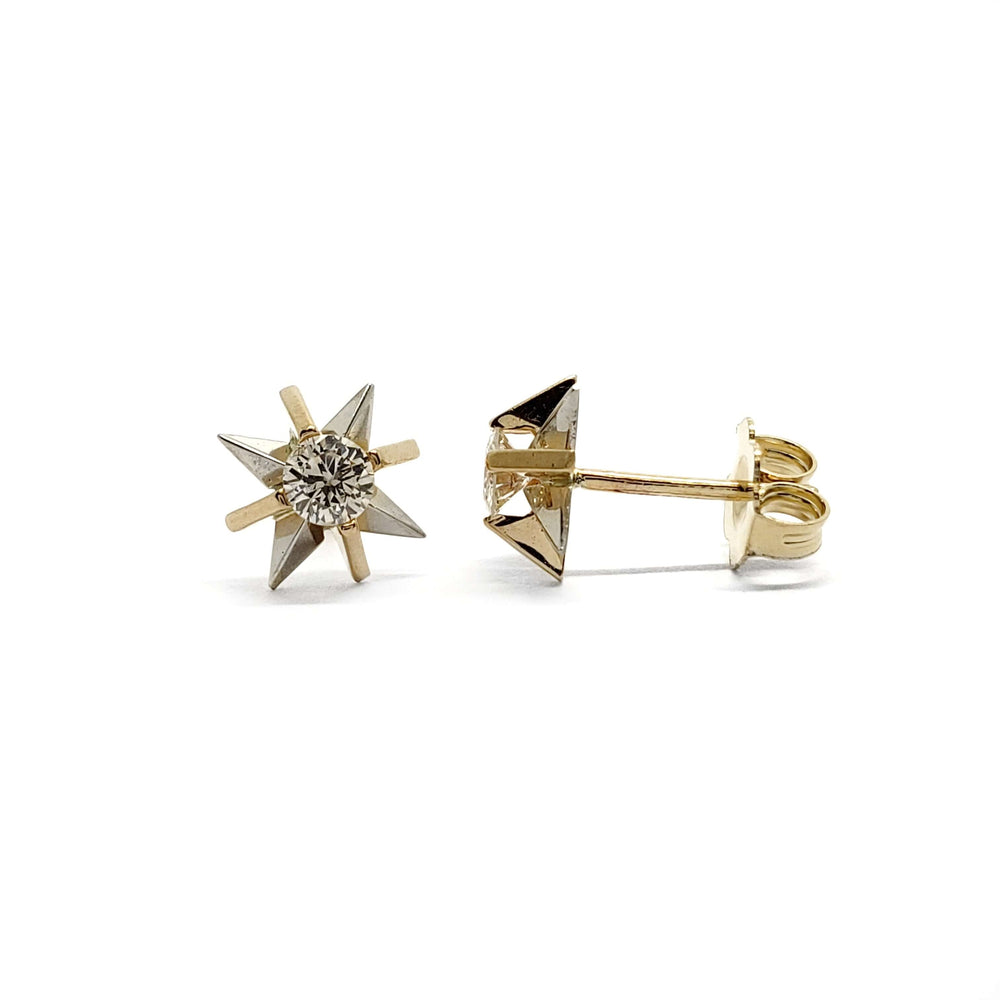 Pair of vintage starburst stud earrings in 14kt yellow and white gold with round diamonds