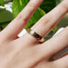 14kt yellow gold Art Deco wedding ring with brushed finish shown on hand