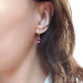 14kt yellow gold drop earring with oval Madagascar garnet shown worn on ear