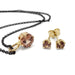 14kt yellow gold pendant and stud earrings with cushion and round Malaya garnets on black chain
