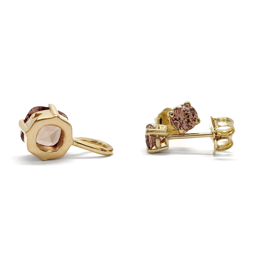 Side view of 14kt yellow gold Malaya garnet pendant and earrings showing gemstone settings