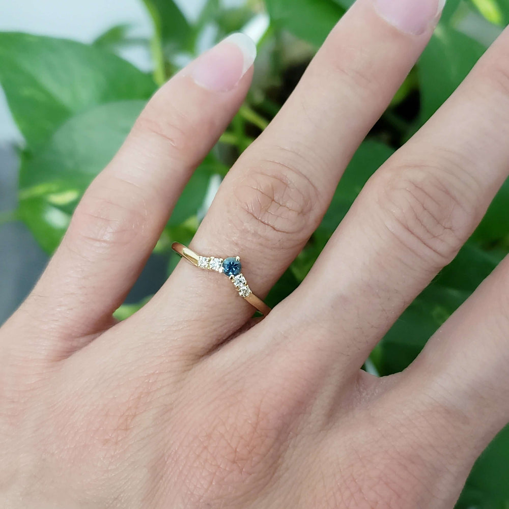 14kt yellow gold Montana sapphire and diamond ring worn on hand