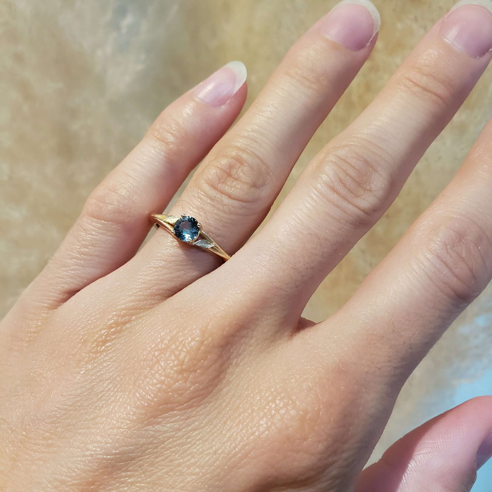 14kt yellow gold Montana sapphire ring shown on hand