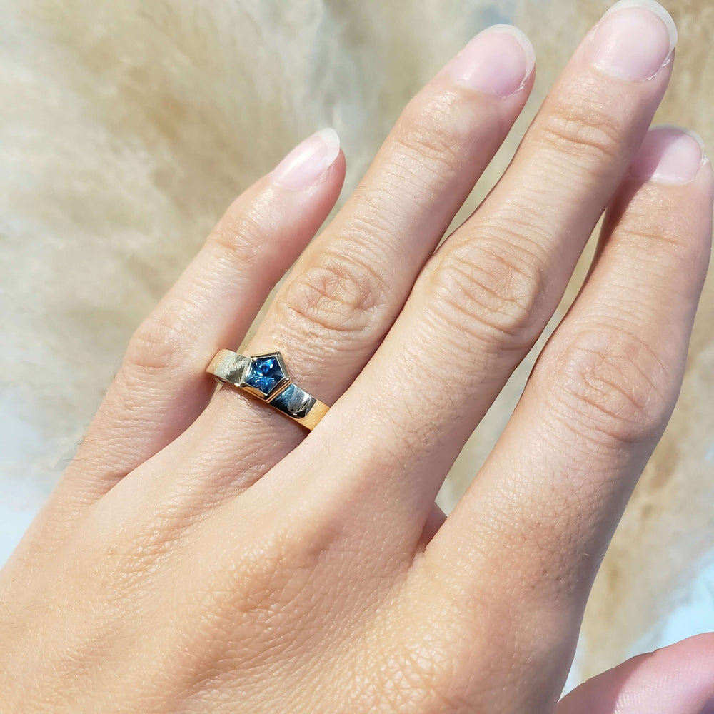 14kt yellow gold Montana sapphire ring worn on hand