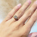 14kt yellow gold asscher cut lab diamond engagement ring shown on a hand