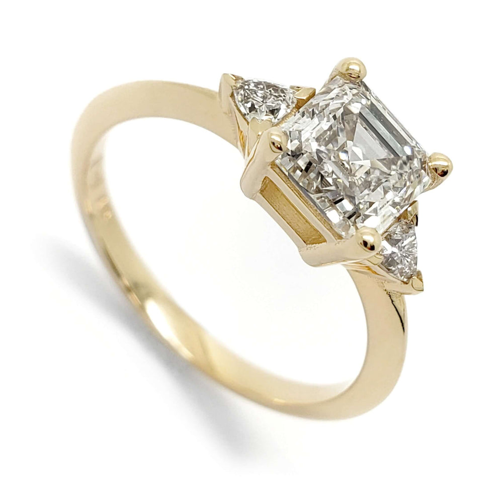 14kt yellow gold engagement ring with asscher cut lab diamond and two trillion side diamonds