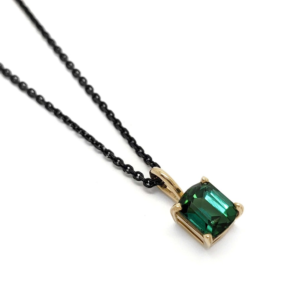 14kt yellow gold pendant with barrel cut green tourmaline on black chain