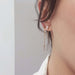 14kt yellow gold chain stud earring jacket worn with pearl and garnet studs