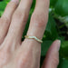 14kt yellow gold chevron diamond wedding ring worn on hand