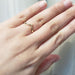 14kt yellow gold chevron wedding ring shown on hand