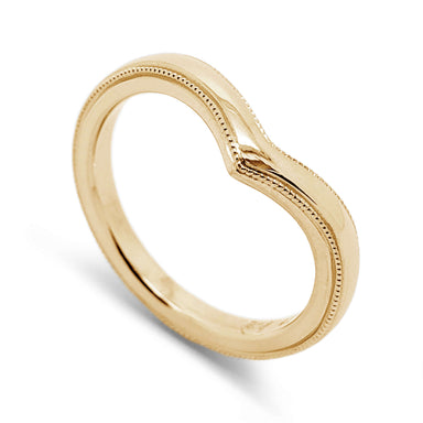 14kt yellow gold chevron wedding ring with millgrain detail, angled view