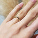 14kt yellow gold chevron wedding ring worn on a hand