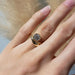 14kt yellow gold curvy lab diamond ring worn on hand, natural light