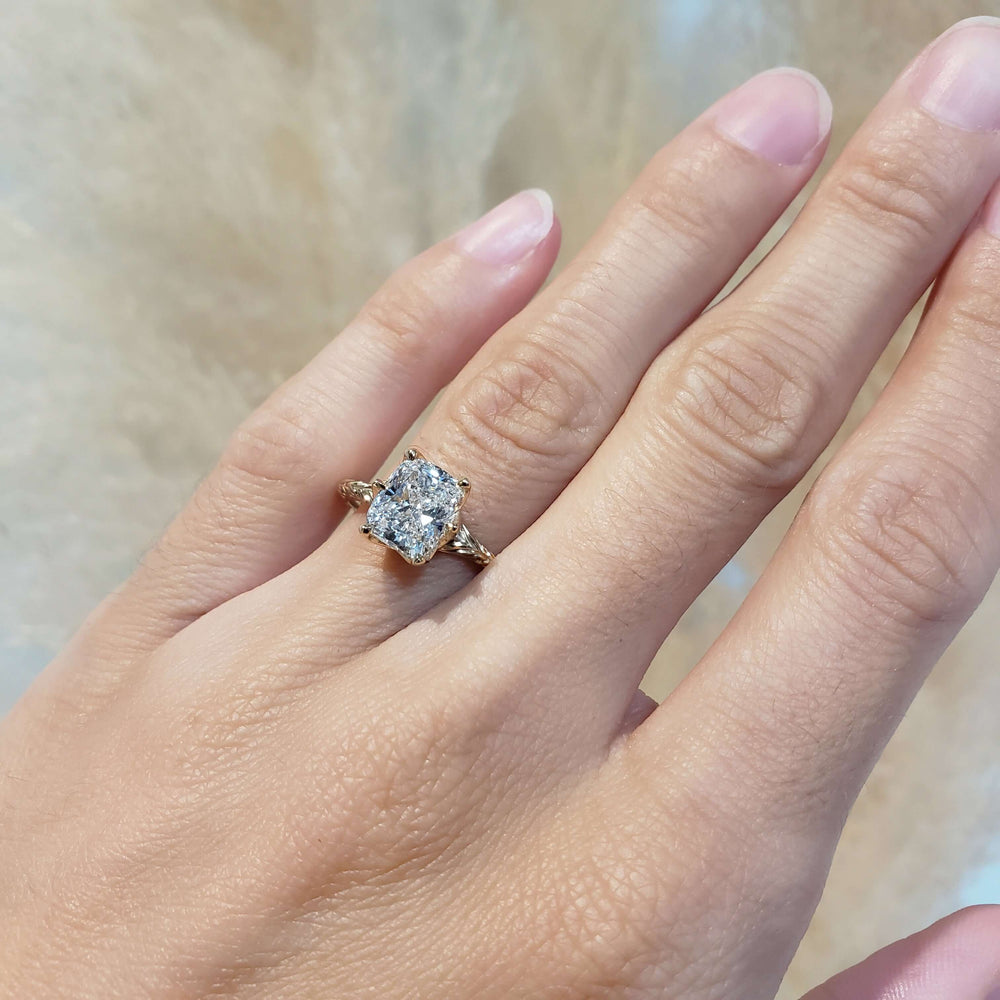 14kt yellow gold cushion cut lab diamond engagement ring shown on hand