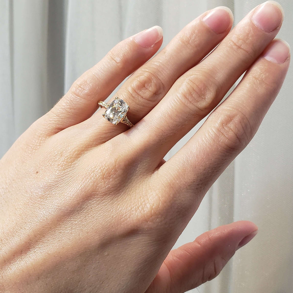 14kt yellow gold cushion lab diamond engagement ring shown on hand