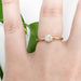 14kt yellow gold diamond solitaire ring shown on hand