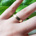 14kt yellow gold elephant skin texture wedding ring worn on a hand