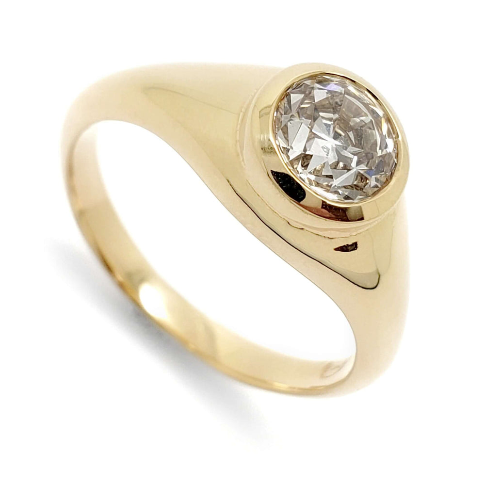 14kt yellow gold engagement ring with bezel-set round lab diamond, angled view