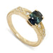 14kt yellow gold engagement ring with blue-green oval sapphire and diamond accents