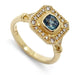 14kt yellow gold engagement ring with cushion cut blue Montana sapphire and diamond halo