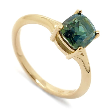 14kt yellow gold engagement ring with cushion cut green sapphire, angled view