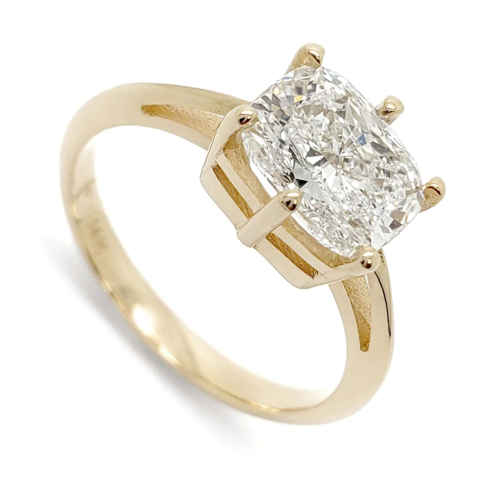 14kt yellow gold engagement ring with an elongated cushion cut lab diamond in a prong setting