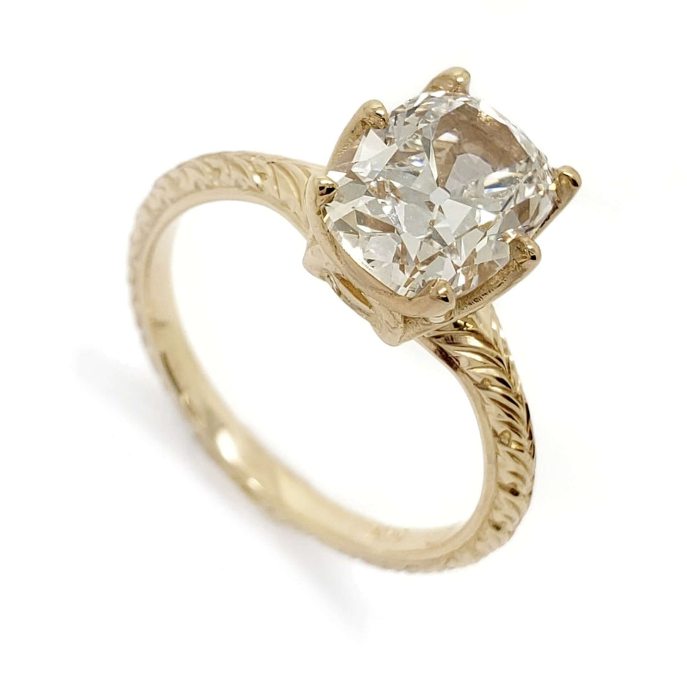 14kt yellow gold engagement ring with cushion cut lab diamond and hand-engraved band