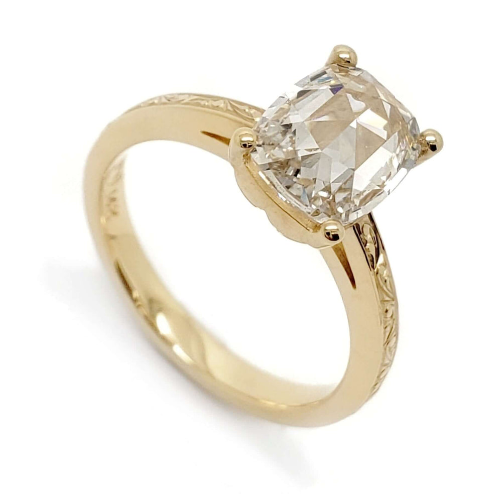 14kt yellow gold engagement ring with elongated cushion rose cut lab diamond and hand engraving