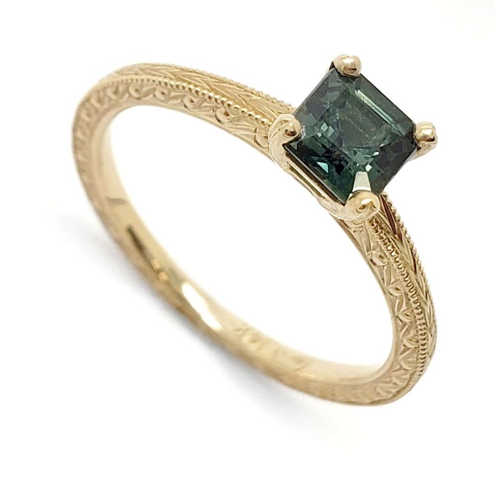 14kt yellow gold engagement ring with asscher cut green sapphire and engraved band