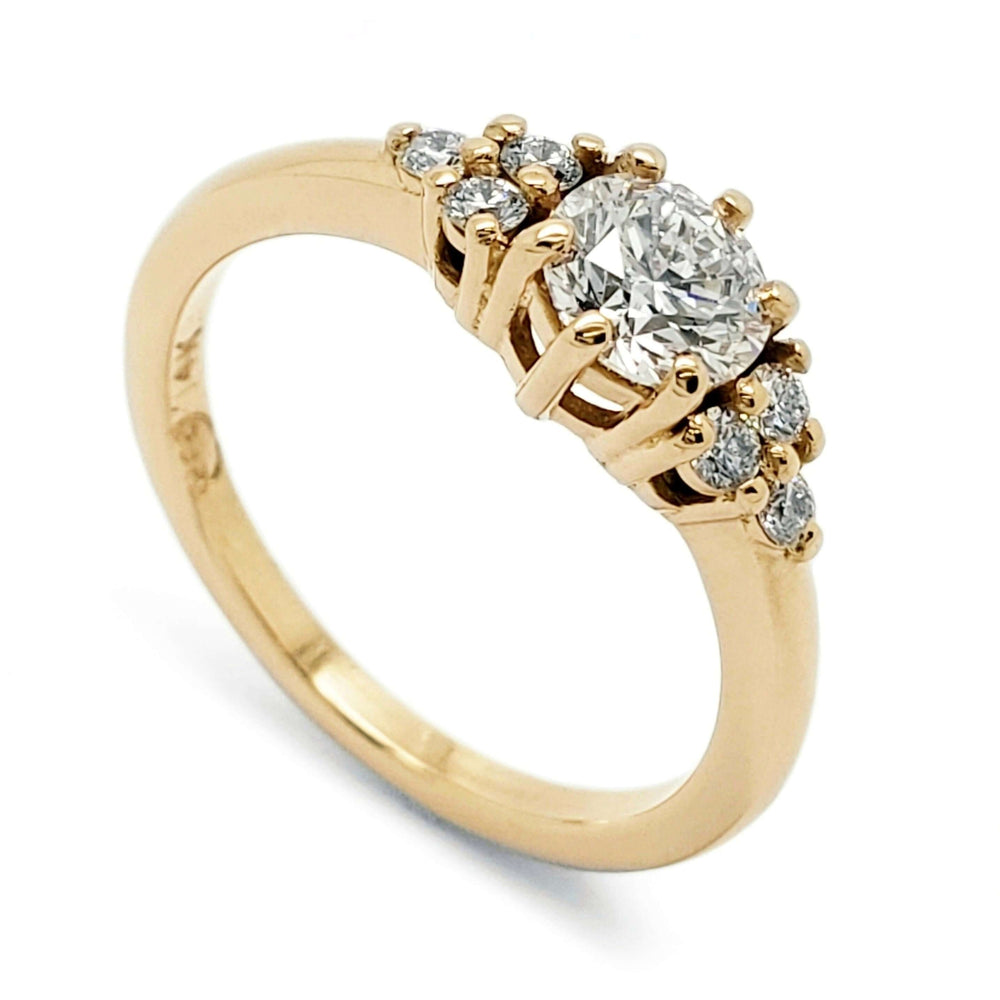 14kt yellow gold engagement ring with round lab diamond and six accent diamonds in claw setting