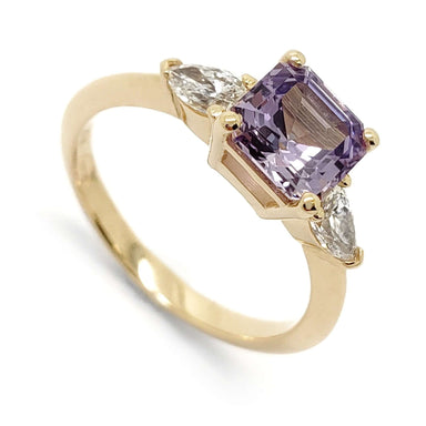 Three-stone engagement ring in 14kt yellow gold with asscher cut lavender sapphire and pear lab diamonds