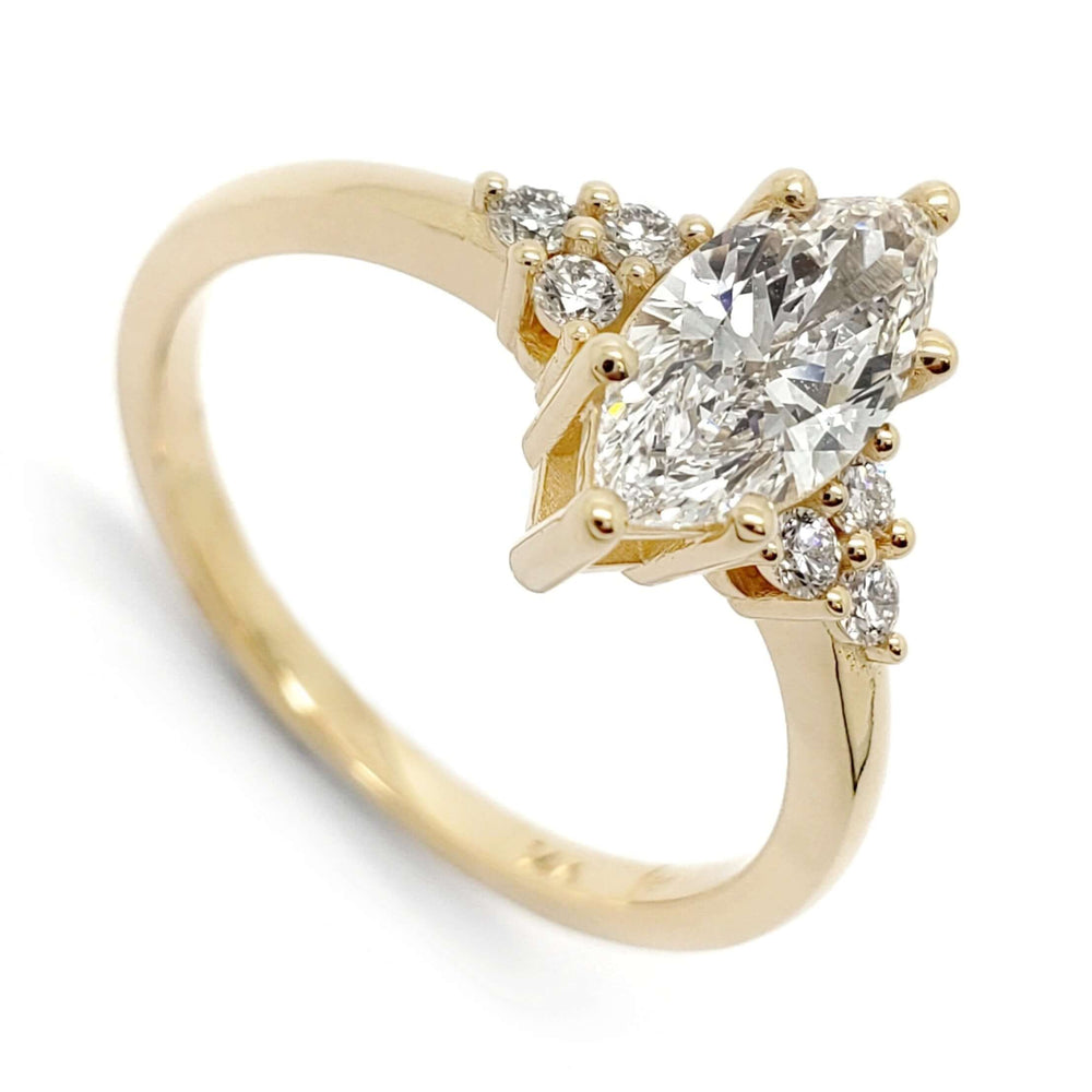 14kt yellow gold engagement ring with marquise cut lab diamond and round diamond accents