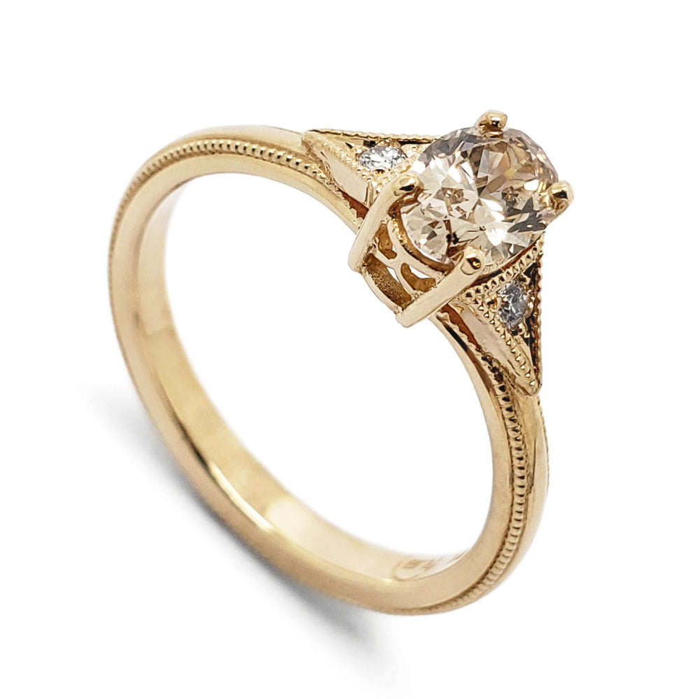 14kt yellow gold engagement ring with oval champagne diamond and side Canadian diamonds
