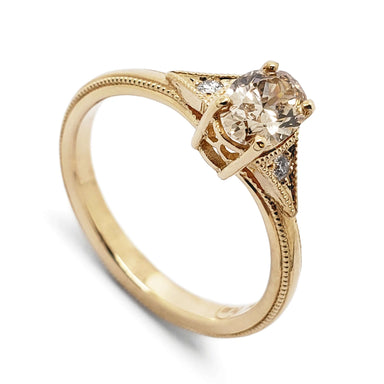 14kt yellow gold engagement ring with oval champagne diamond and side Canadian diamonds