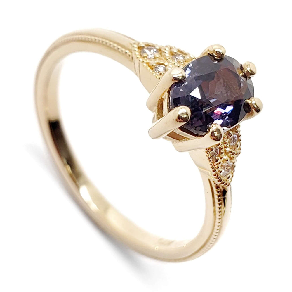 14kt yellow gold engagement ring with oval deep purple sapphire and Canadian diamonds