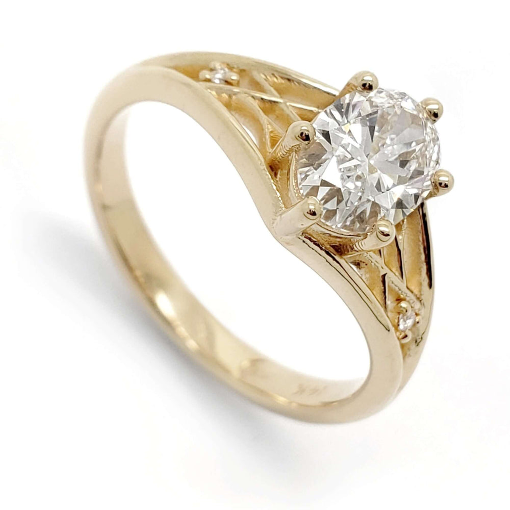 14kt yellow gold engagement ring with oval lab diamond and lattice detail