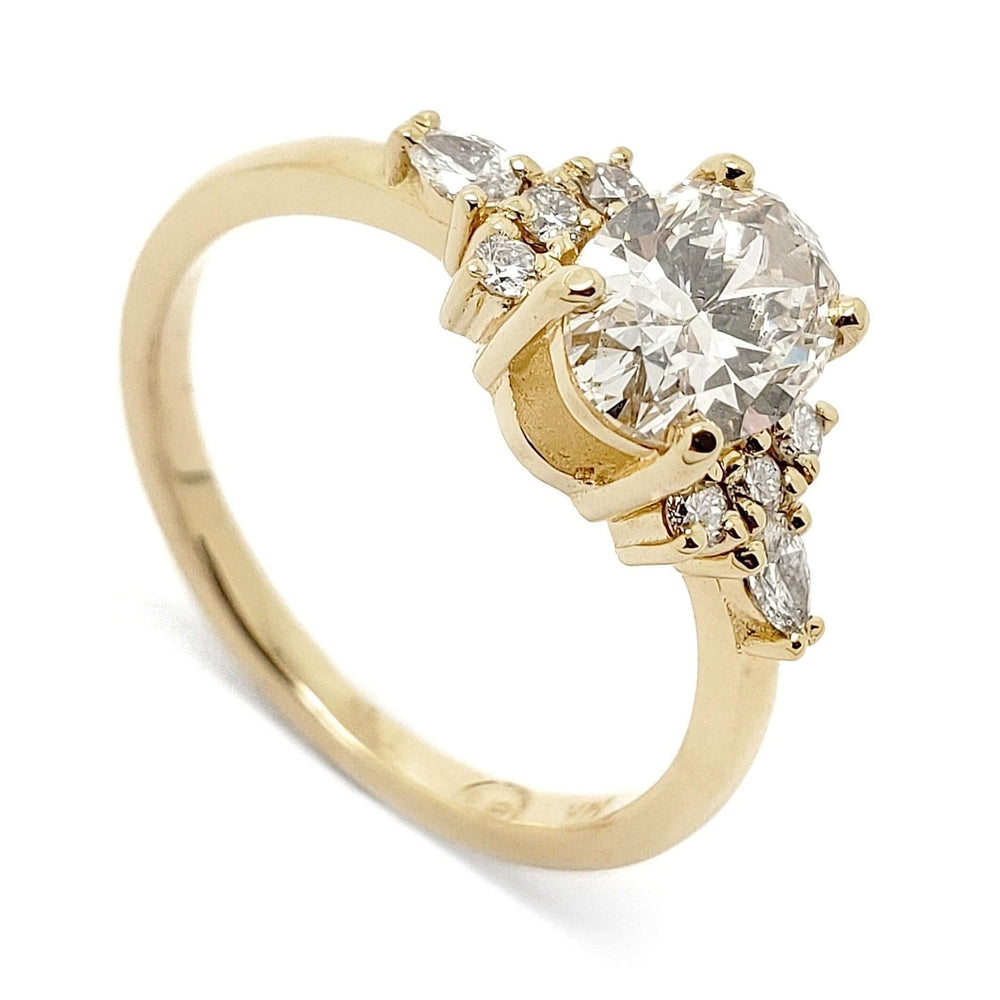 14kt yellow gold engagement ring with oval lab grown diamond and symmetrical cluster setting