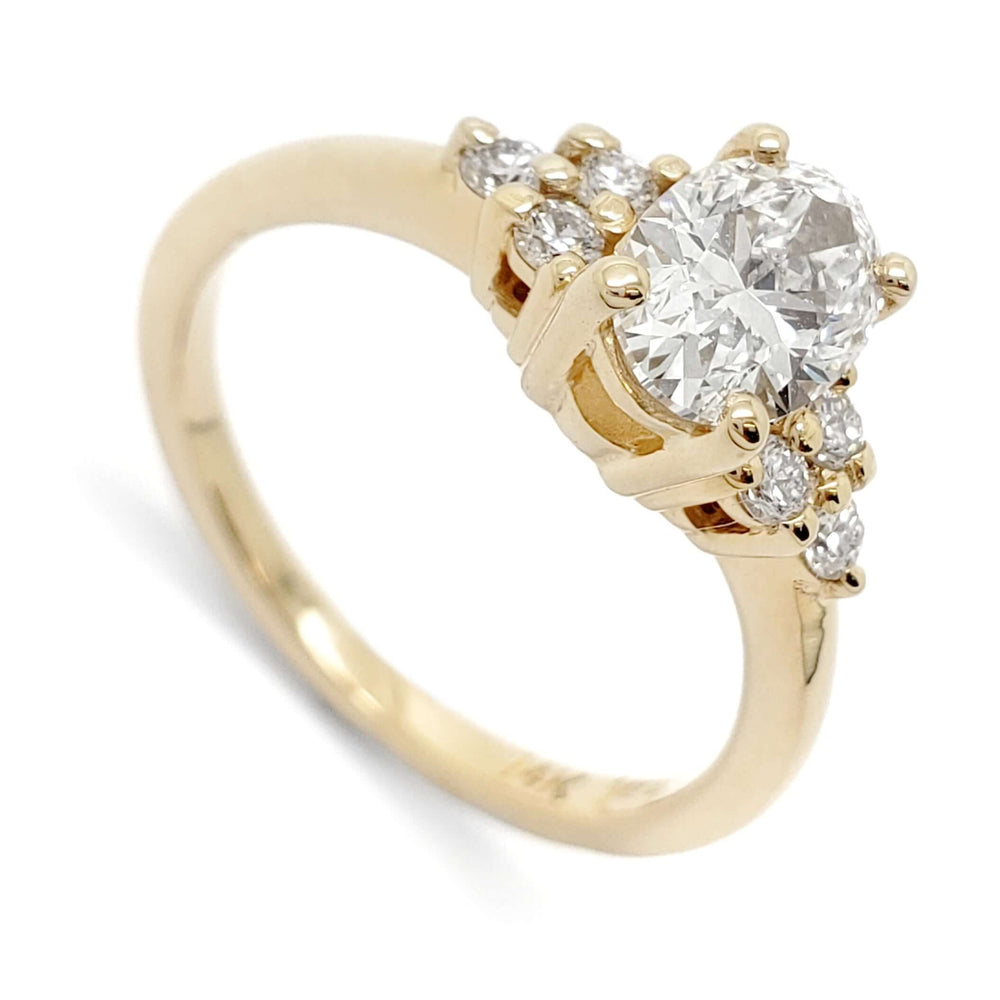 14kt yellow gold engagement ring with oval lab grown diamond and round diamond accents