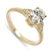 14kt yellow gold engagement ring with oval lab grown diamond and millgrain detail