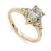 14kt yellow gold engagement ring with pear cut lab grown diamond and round diamond accents